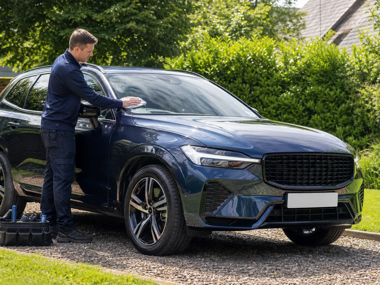 A mobile windscreen technician working on a Volvo XC60 in Liverpool.